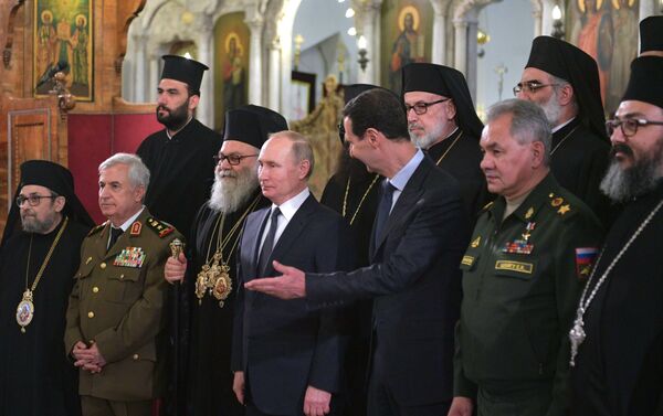 الرئيس الروسي فلاديمير بوتين والرئيس السوري بشار الأسد في كاتدرائية السيدة العذراء مريم في دمشق - سبوتنيك عربي