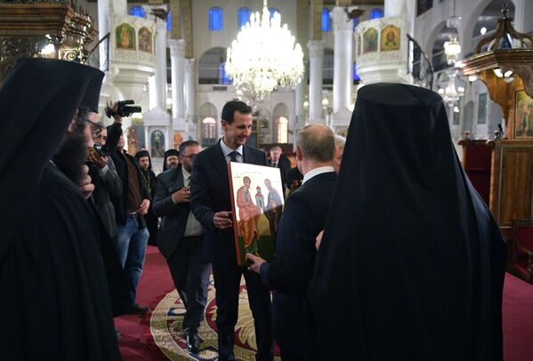 الرئيس فلاديمير بوتين والرئيس بشار الأسد يزوران الكنيسة المريمية‎ في دمشق، 7 يناير 2020 - سبوتنيك عربي