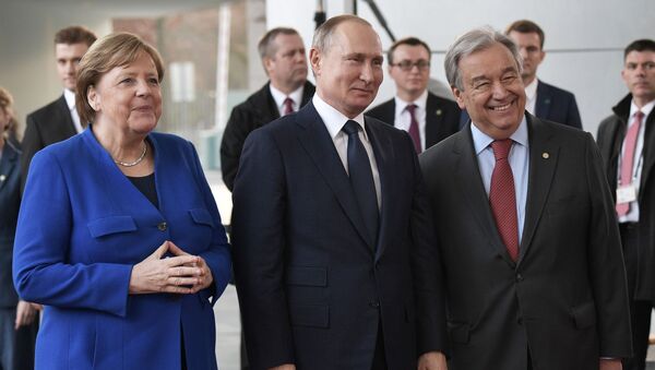 بوتين وميركل وغويترش في مؤتمر برلين حول ليبيا - سبوتنيك عربي