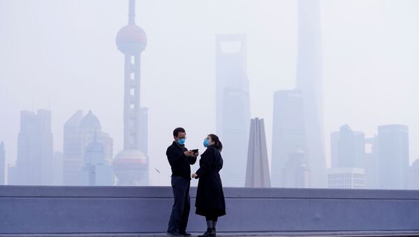 أشخاص يرتدون أقنعة واقية في شنغهاي، الصين 3 فبراير 2020 - سبوتنيك عربي