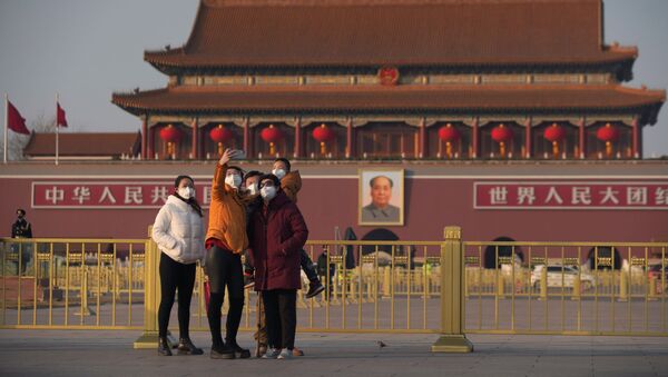 زوار يرتدون أقنعة واقية في بكين، 30 يناير 2020 - سبوتنيك عربي