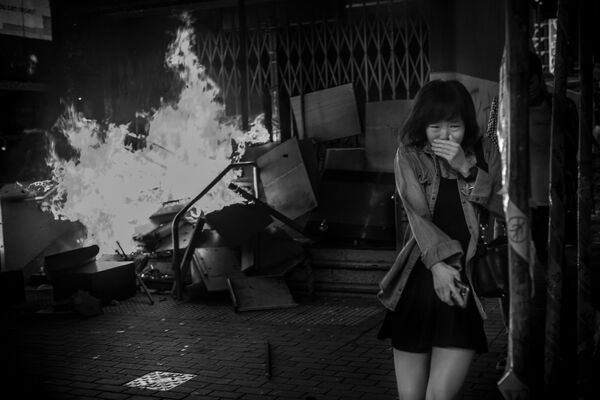 صورة بعنوان معركة على أرض الواقع هونغ كونغ010، من سلسلة هونغ كونغ010، للمصور الأمريكي ديفيد بوتو، مُدرجة في القائمة القصيرة لجائزة سوني العالمية للتصوير 2020 في فئة الوثائقية - سبوتنيك عربي