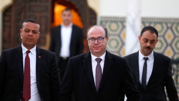 رئيس الوزراء التونسي إيليس الفخفاخ يغادر بعد لقاء الرئيس التونسي قيس سعيد - سبوتنيك عربي