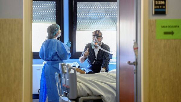 أطباء مستشفى كريمونا، الذين يكافحون مرض Covid-19 إيطاليا مارس 13 مارس 2020، كورونا - سبوتنيك عربي