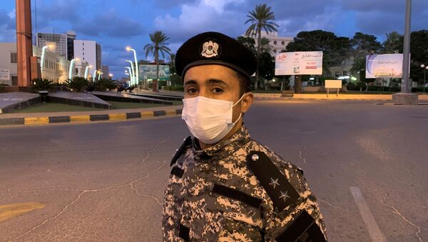 جندي ليبي يرتدي قناعا طبيا للحماية من كورونا - سبوتنيك عربي