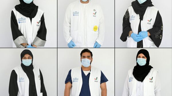 متطوعون لمساعدة الأطباء في مواجهة أزمة كورونا في الإمارات العربية المتحدة، 9 أبريل 2020 - سبوتنيك عربي