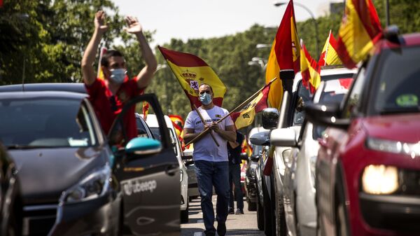 احتجاجات ضد الاجراءات الاحترازية لمكافحة فيروس كورونا في مدريد، إسبانيا 23 مايو/ أيار 2020 - سبوتنيك عربي