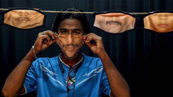 رجل يرتدي كمامة من صنع يديه في تشيناي، في الهند 26  مايو/ أيار 2020 - سبوتنيك عربي
